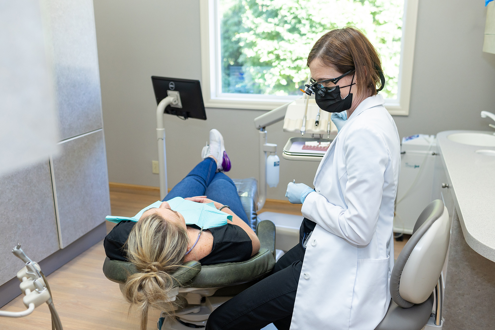 Dr. Matlock speaking with a patient at Matlock Dental in Eugene, Oregon.