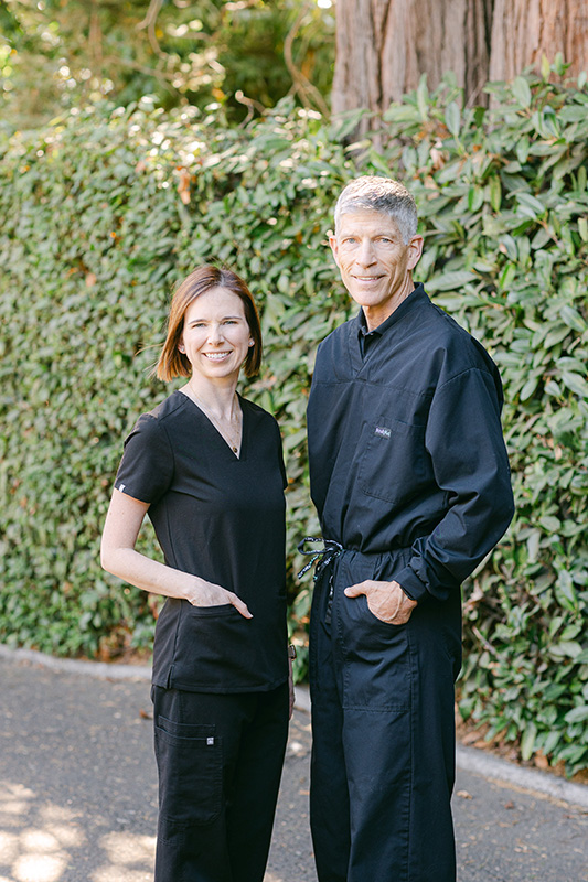 Dr. Matlock & Dr. Stephenson standing together outside Matlock Dental in Eugene, Oregon