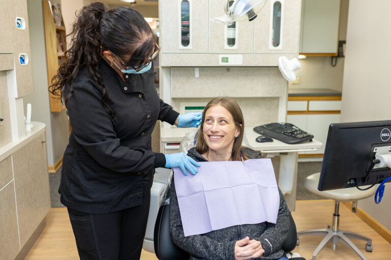 Rachel checking in on a patient at Matlock Dental in Eugene, Oregon.